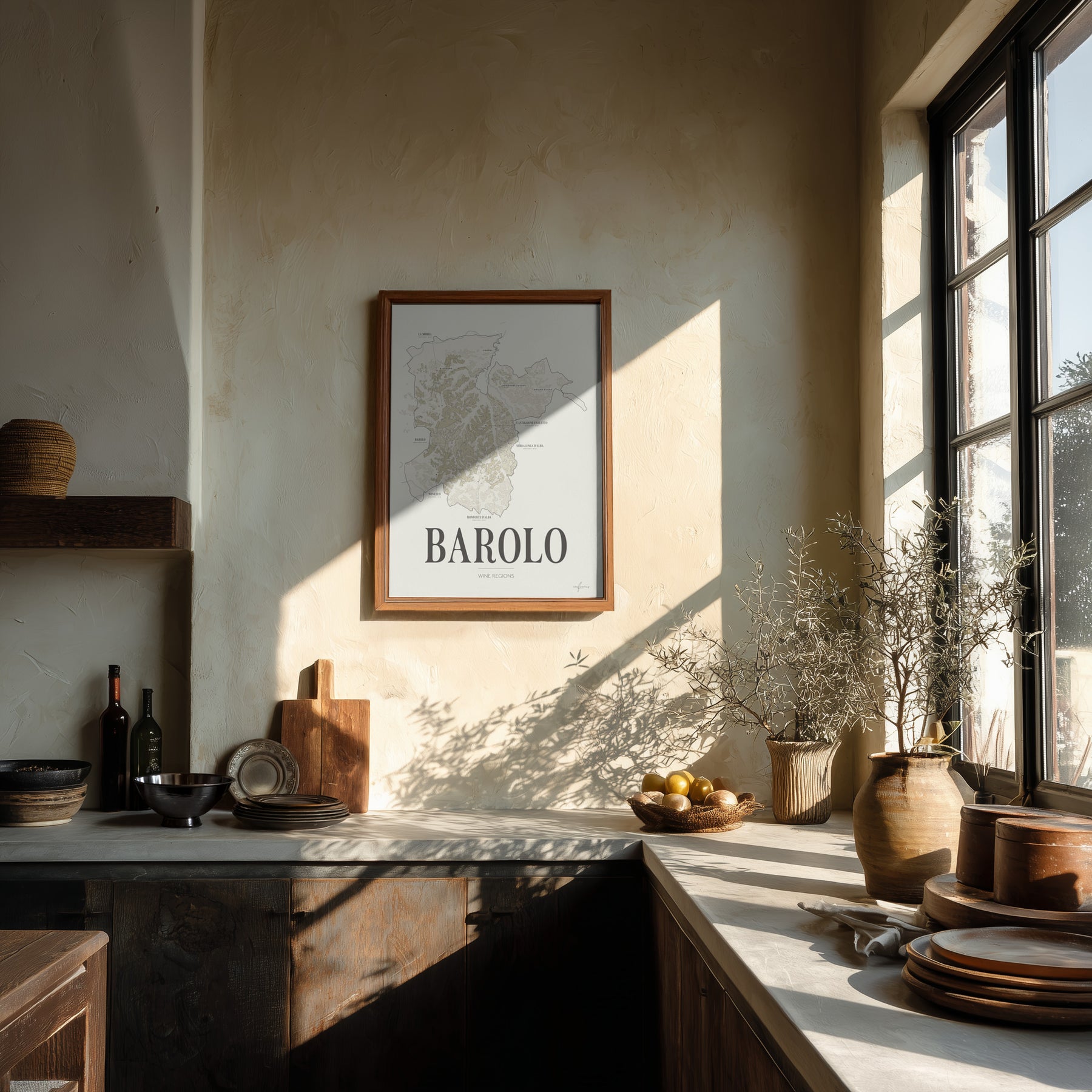 Barolo Wine Map poster by Corkframes in a wooden frame on a plaster wall in a sunlit kitchen