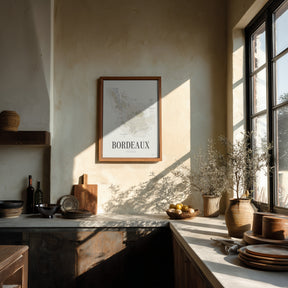 Bordeaux Wine Map poster by Corkframes in a slim frame on a plaster wall in a sunlit kitchen