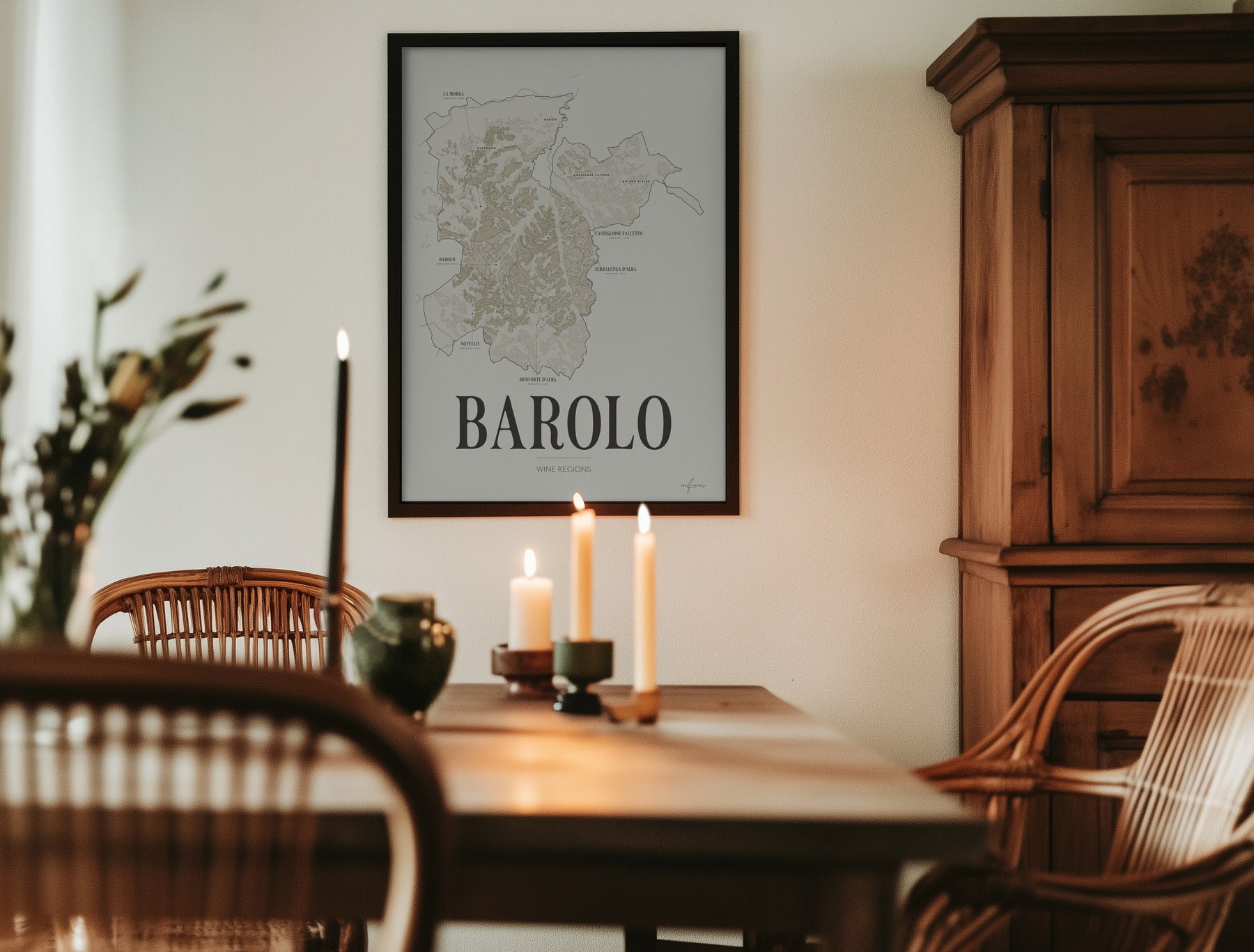 Barolo Wine Map poster by Corkframes framed in a dining room with candles and an antique wooden cabinet