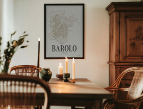 Barolo Wine Map poster by Corkframes framed in a dining room with candles and an antique wooden cabinet