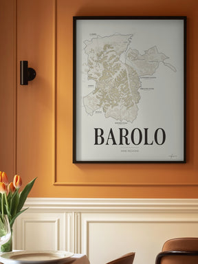 Barolo Wine Map poster by Corkframes in a black frame on a warm orange wall above panelling