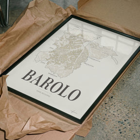 Barolo Wine Map poster by Corkframes in a dark frame, resting in tissue paper packaging